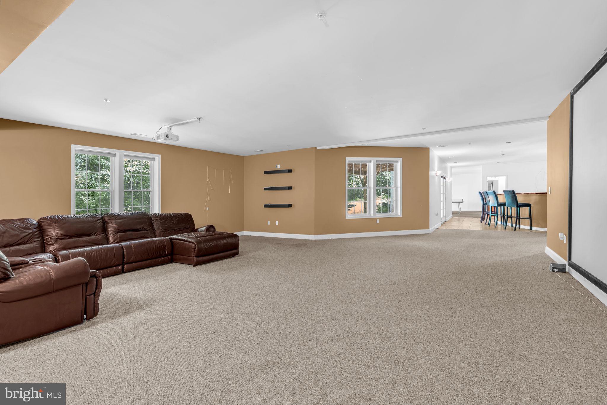 13716 Molly Berry Road Brandywine, MD 20613 - Photo 45 of 75 a living room with furniture and a window