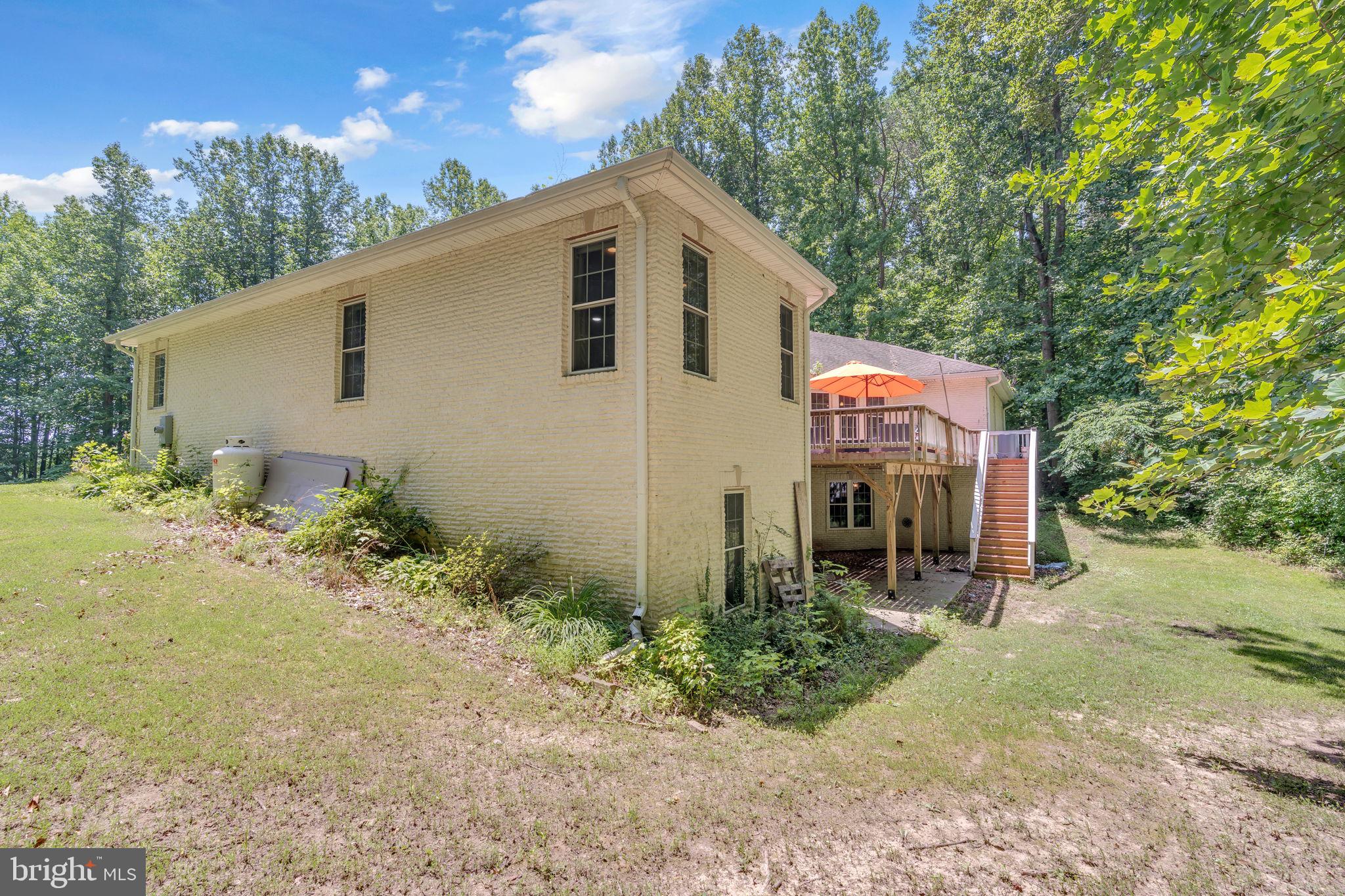 13716 Molly Berry Road Brandywine, MD 20613 - Photo 53 of 75 a front view of a house with garden