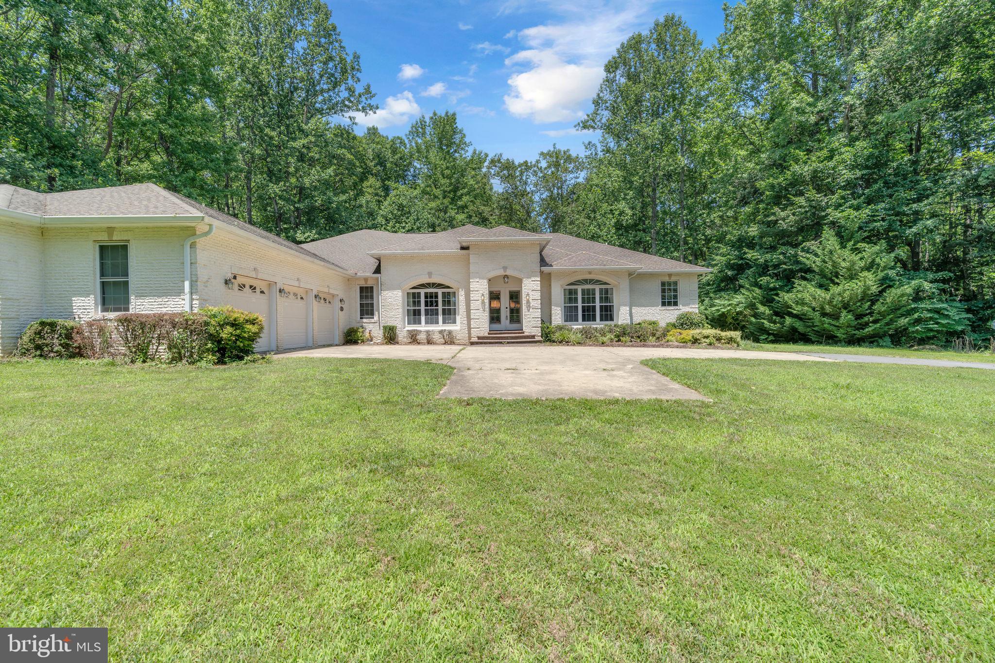 13716 Molly Berry Road Brandywine, MD 20613 - Photo 56 of 75 a front view of a house with garden