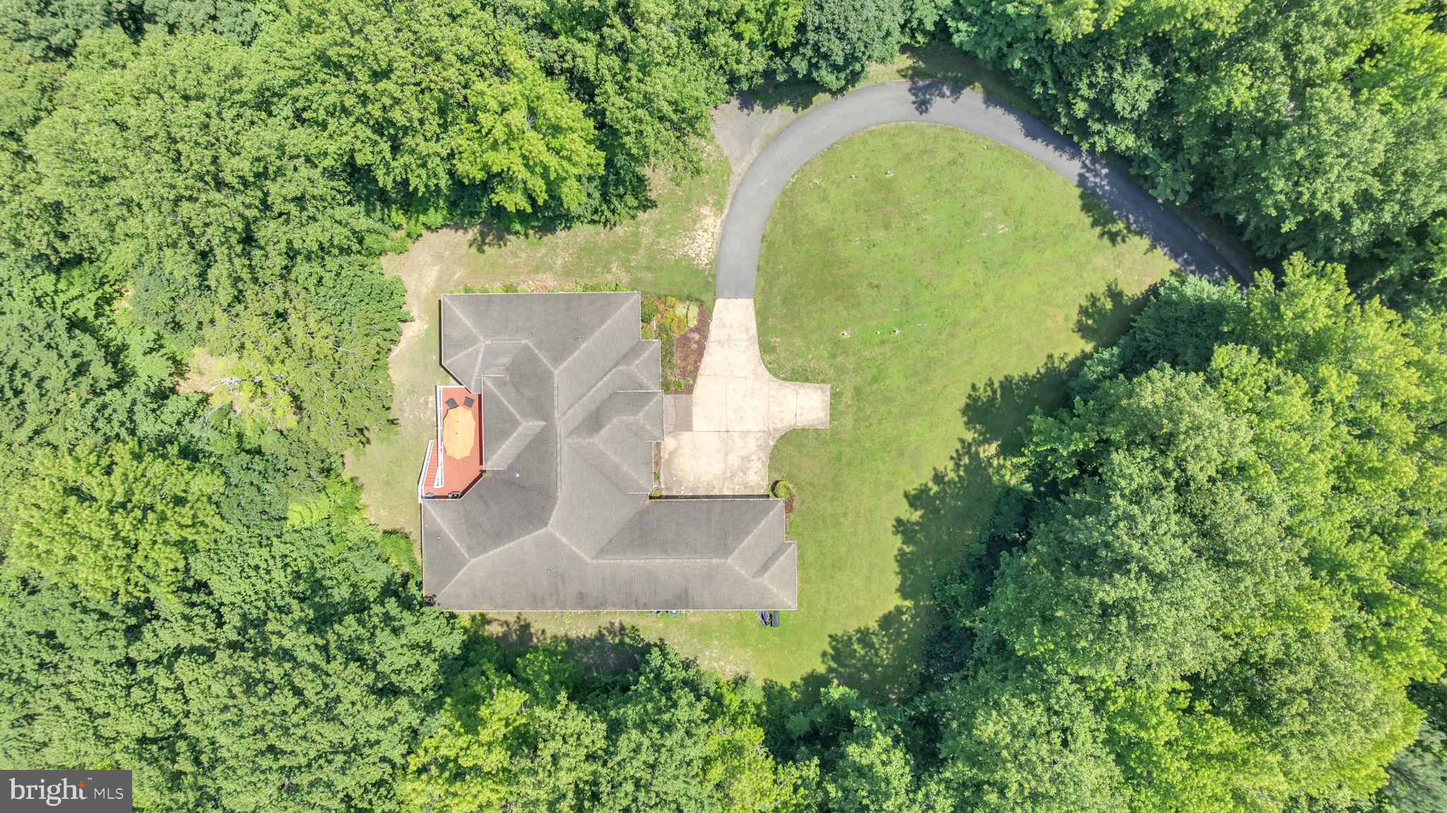13716 Molly Berry Road Brandywine, MD 20613 - Photo 58 of 75 an aerial view of a house with a yard and trees all around
