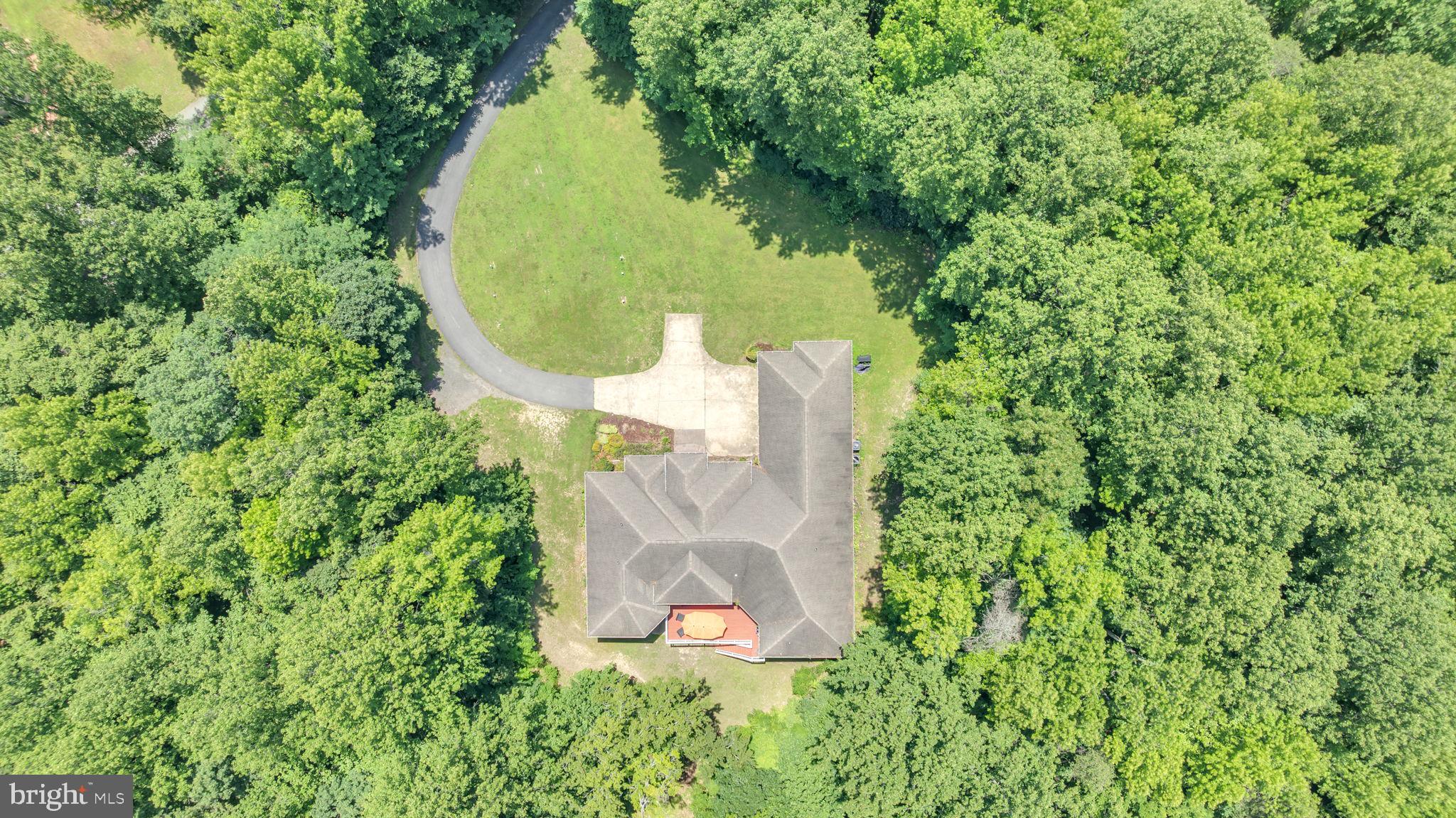 13716 Molly Berry Road Brandywine, MD 20613 - Photo 59 of 75 an aerial view of a house with a yard and trees all around