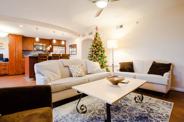 a living room with furniture and a table