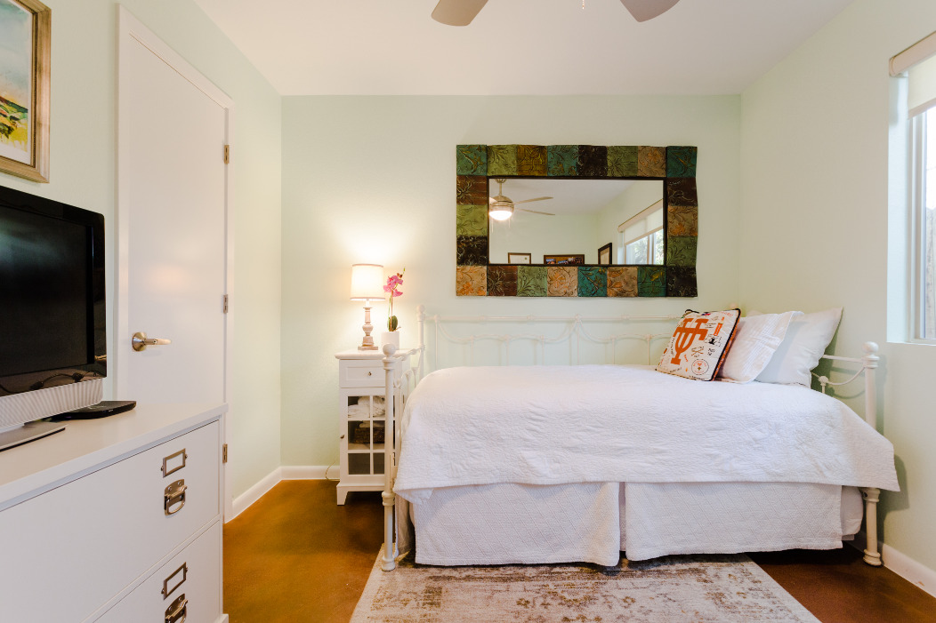 41 Waller Street, Unit 103 Austin, TX 78702 - Photo 13 of 27 a bedroom with a bed and a flat screen tv