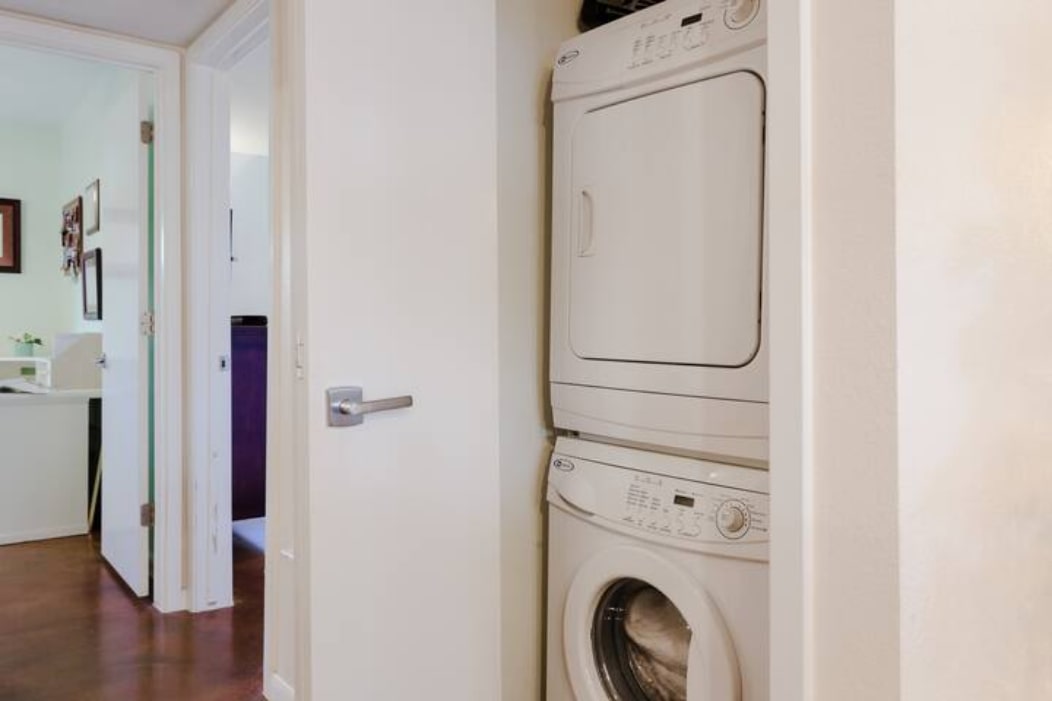 41 Waller Street, Unit 103 Austin, TX 78702 - Photo 23 of 27 a view of a storage & utility room with washer and dryer