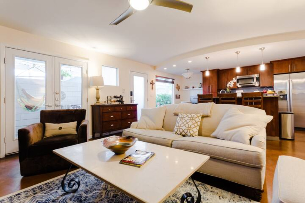 41 Waller Street, Unit 103 Austin, TX 78702 - Photo 3 of 27 a living room with furniture and a view of kitchen