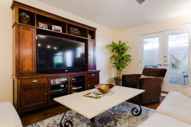 a living room with furniture and a flat screen tv