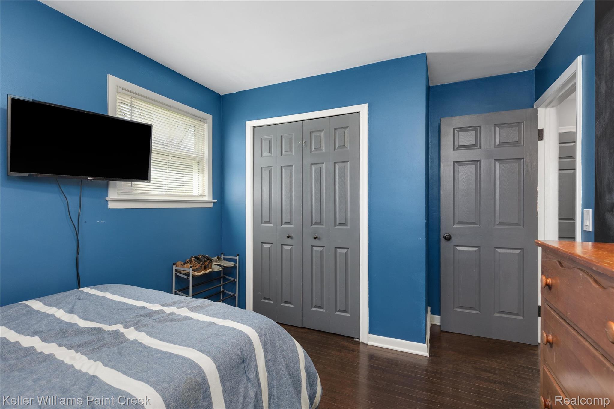 310 Elmhill Road Rochester, MI 48306 - Photo 15 of 37 Bedroom featuring dark wood-style flooring and a closet