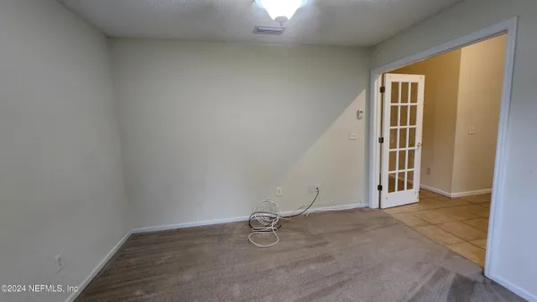 a view of a livingroom with furniture and a ceiling fan