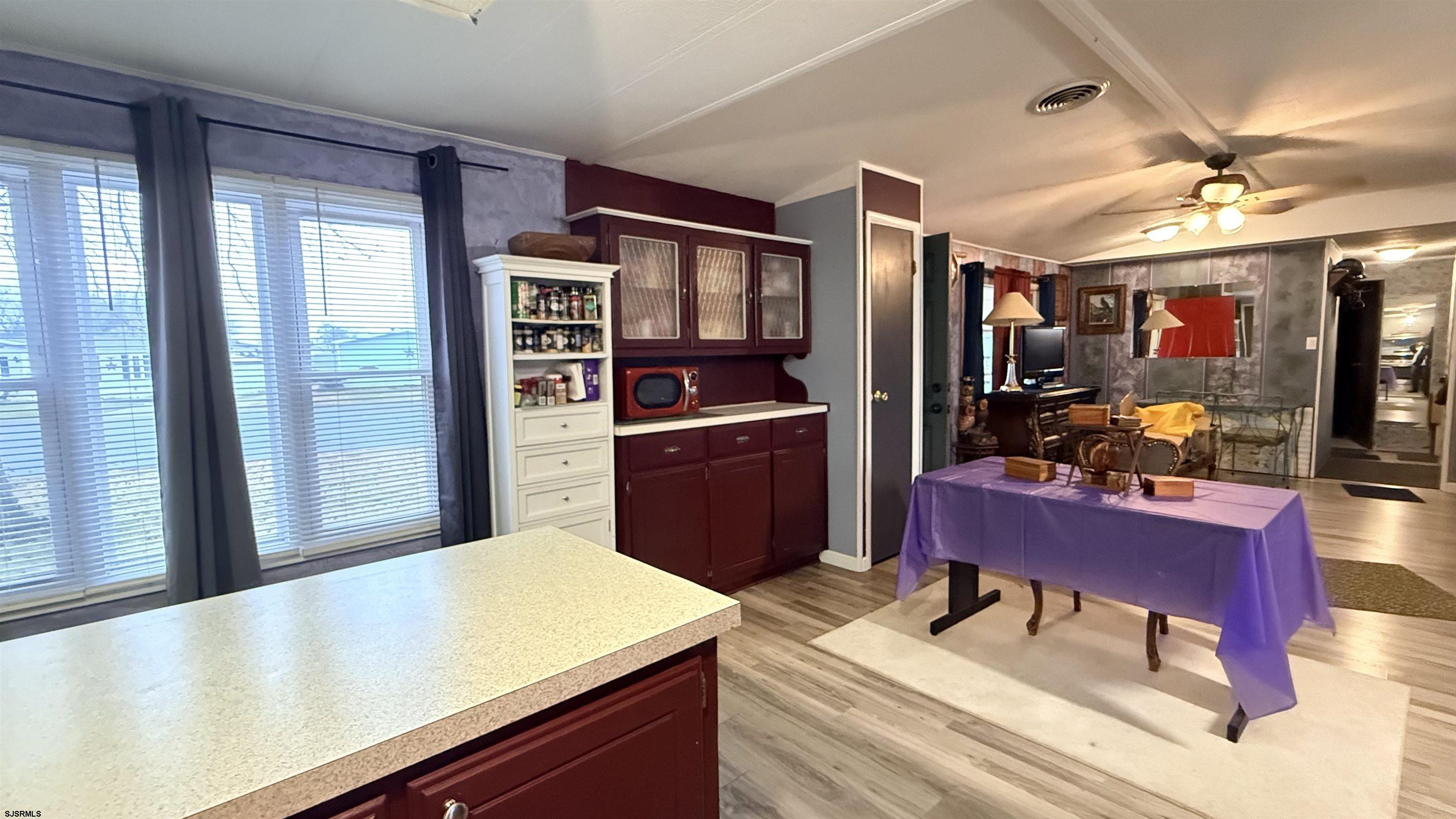 101 Country Lane Buena, NJ 08310 - Photo 11 of 25 a room with stainless steel appliances kitchen island granite countertop furniture and a refrigerator