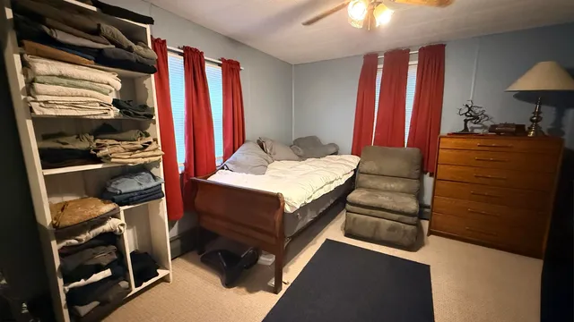 a bed room with a bed and a window