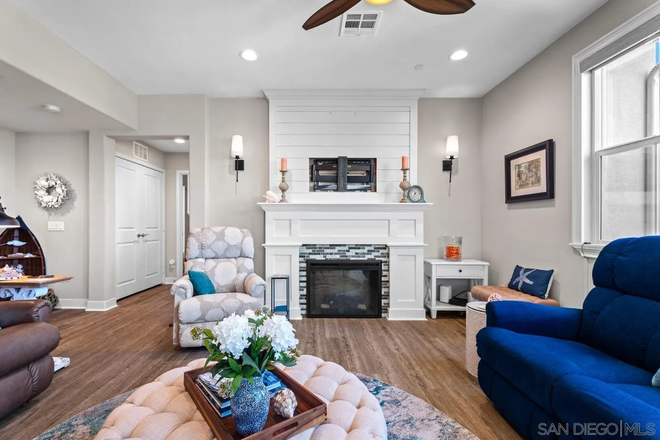 4326 Star Path Way, Unit 1 Oceanside, CA 92056 - Photo 15 of 46 a living room with furniture and a fireplace