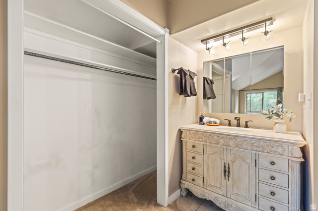 460 Omni Point Road Central Valley, UT 84754 - Photo 65 of 101 Carved vanity with integrated sink, bronze faucet, and coordinating light fixture