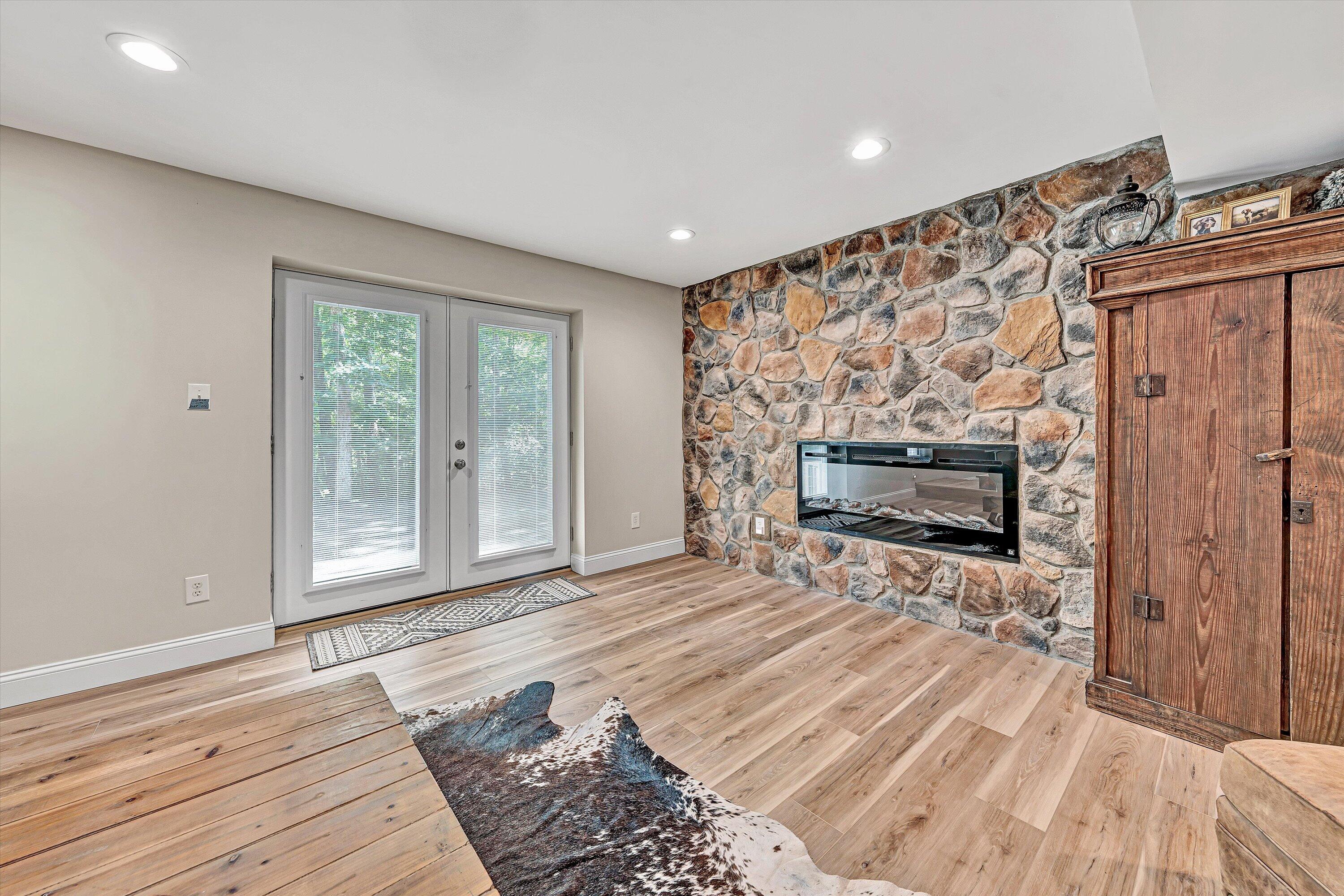 6211 Hillcrest Road Salem, VA 24153 - Photo 25 of 36 a view of empty room with wooden floor and fireplace