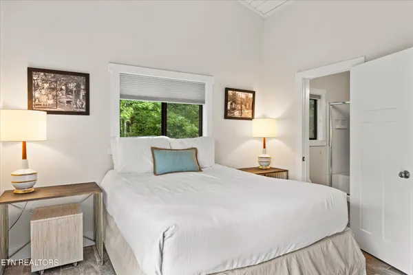 a bathroom with a sink a toilet and a shower