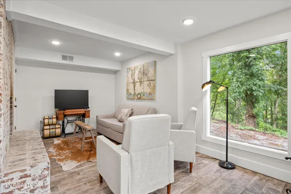 a living room with a couch and a fireplace
