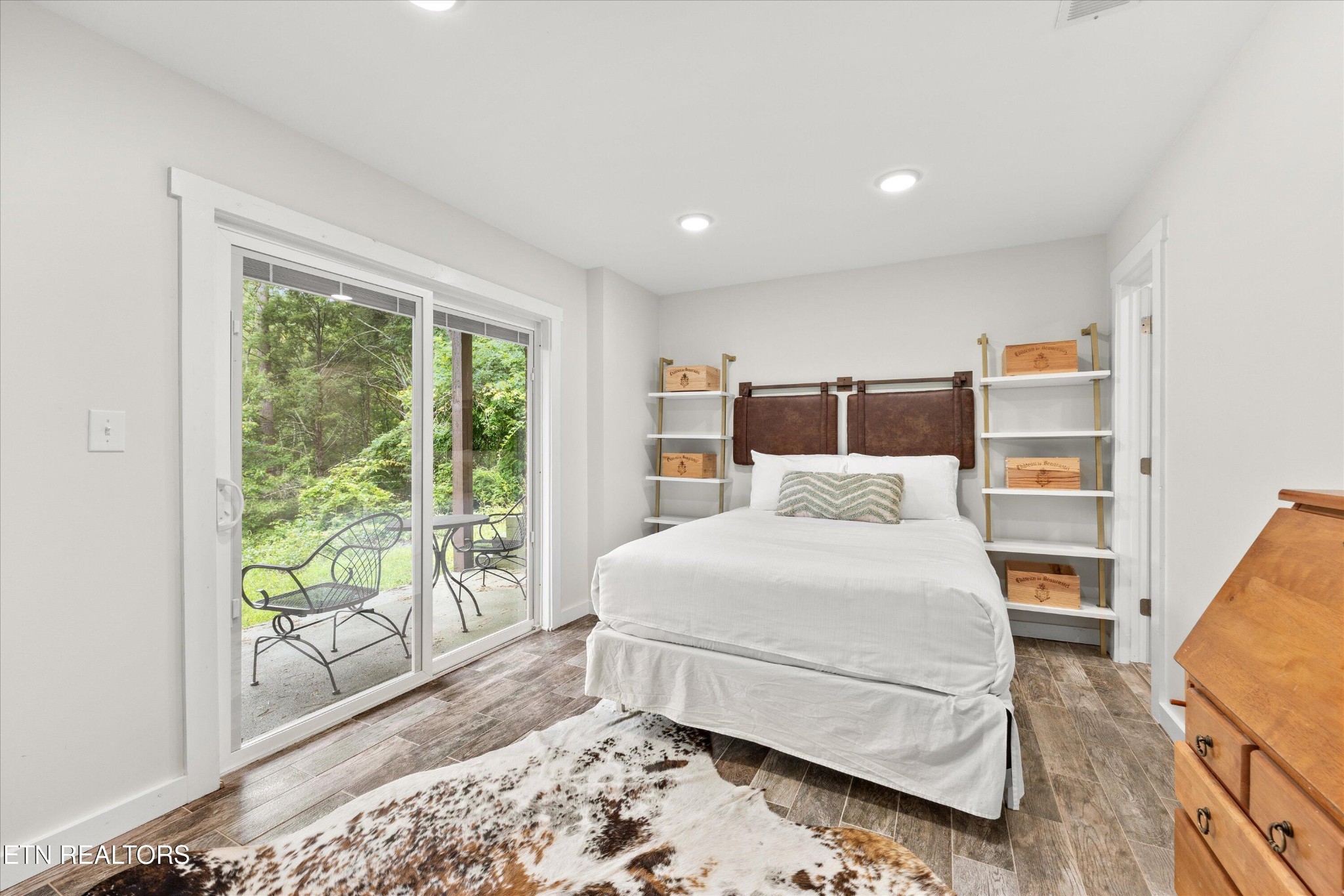 123 Cutter Gap Road Townsend, TN 37882 - Photo 19 of 40 a bedroom with a large bed and a large window