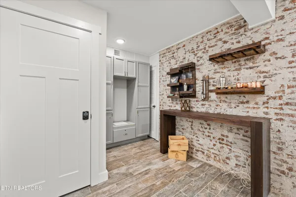 a bathroom with a bathtub sink and mirror