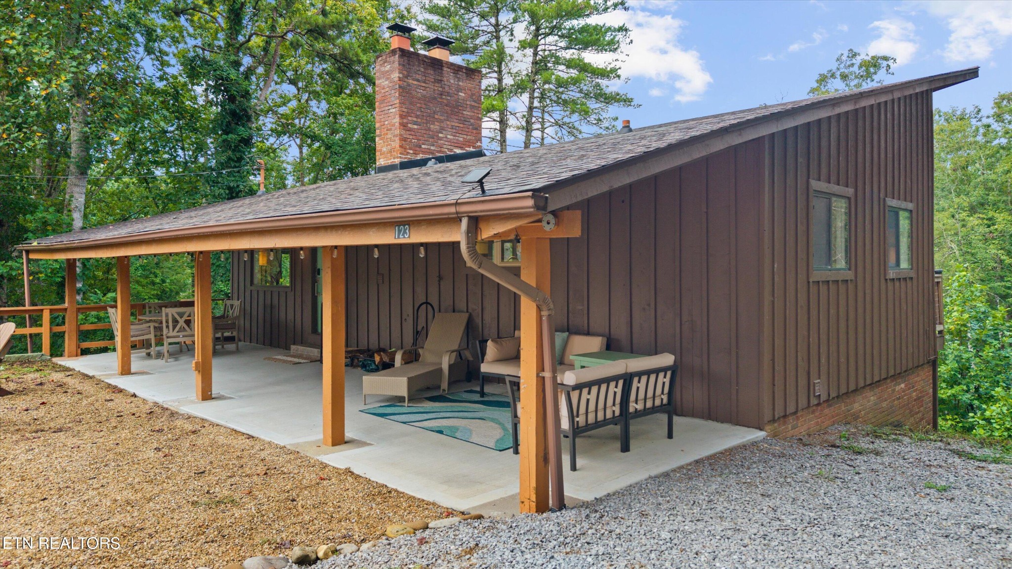 123 Cutter Gap Road Townsend, TN 37882 - Photo 32 of 40 a backyard of a house with seating space