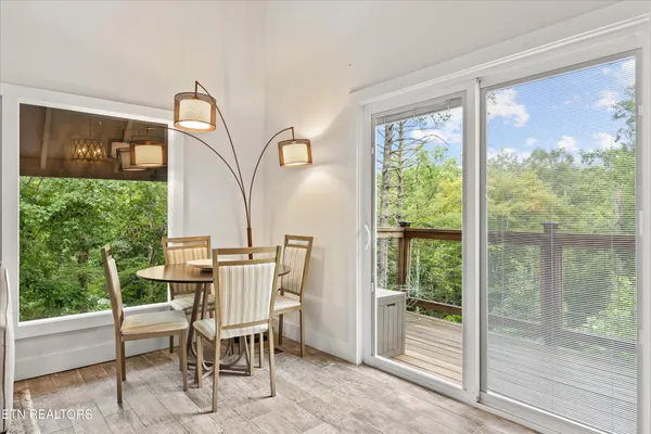 a view of a dining room with furniture window and outside view