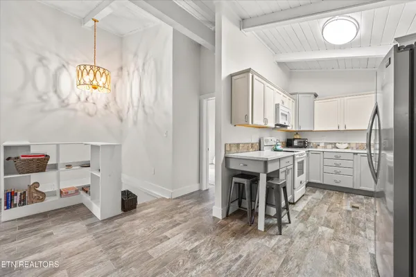 a kitchen with a sink cabinets and window