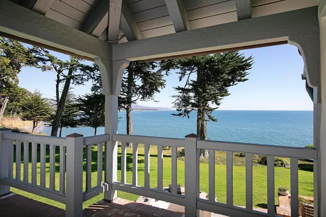 a view of a porch with a large tree