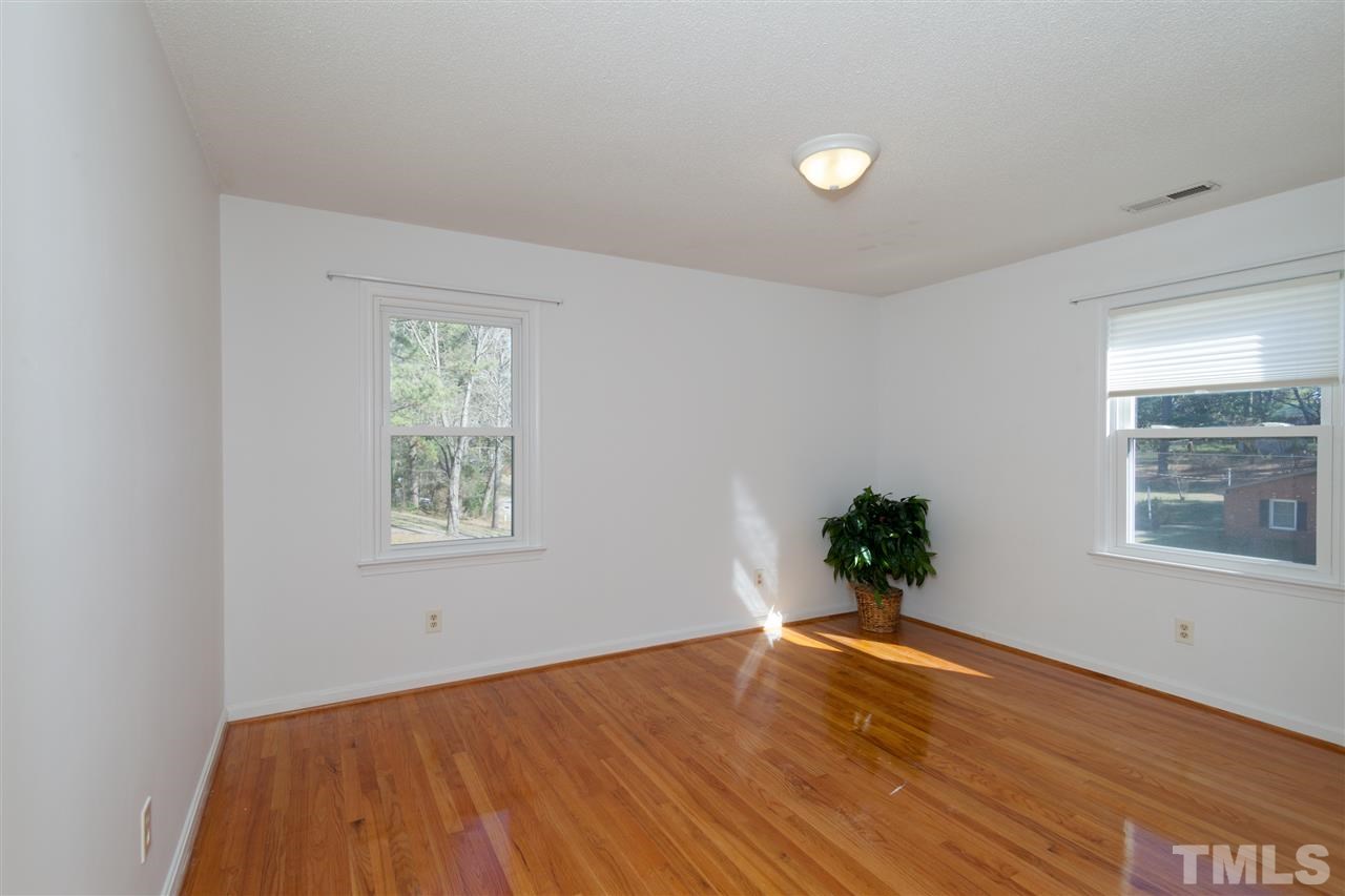 2400 Lawrence Drive Raleigh, NC 27603 - Photo 13 of 24 Bedroom 2 with hardwood floors and a ceiling fan prewire.
