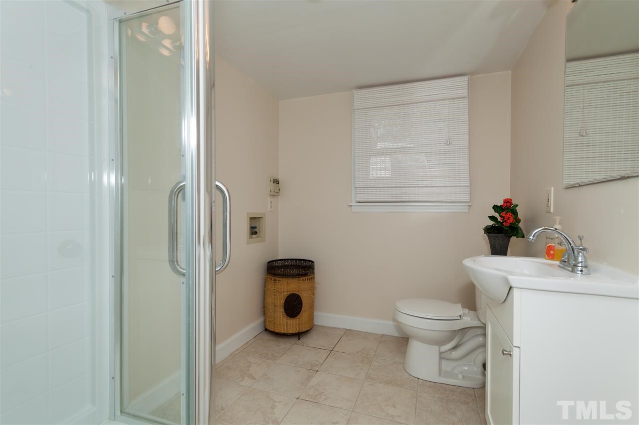 2400 Lawrence Drive Raleigh, NC 27603 - Photo 18 of 24 Second full bath with new tile, new sink, new toilet, new paint, and new shower!