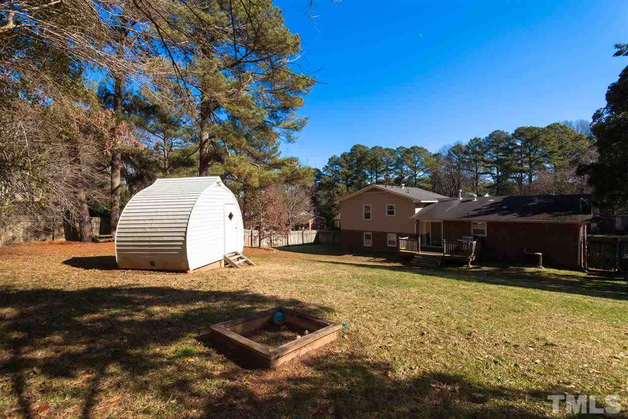 2400 Lawrence Drive Raleigh, NC 27603 - Photo 22 of 24 Storage shed/detached sauna in back yard conveys.