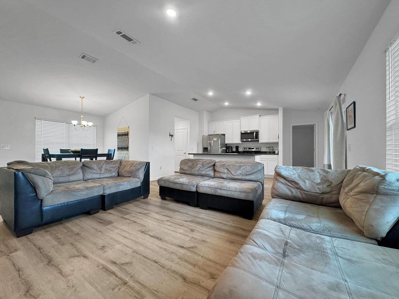 4695 Perception Circle Milton, FL 32570 - Photo 18 of 30 a living room with furniture and a couch