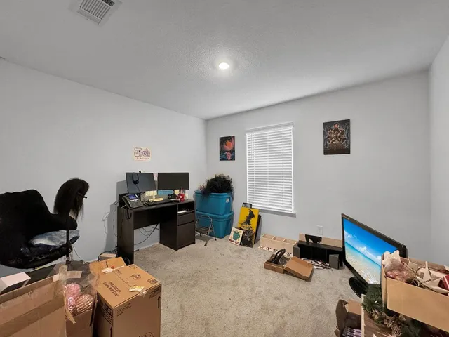 a bedroom with a workspace
