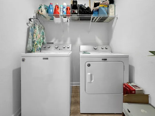 a utility room with dryer and washer