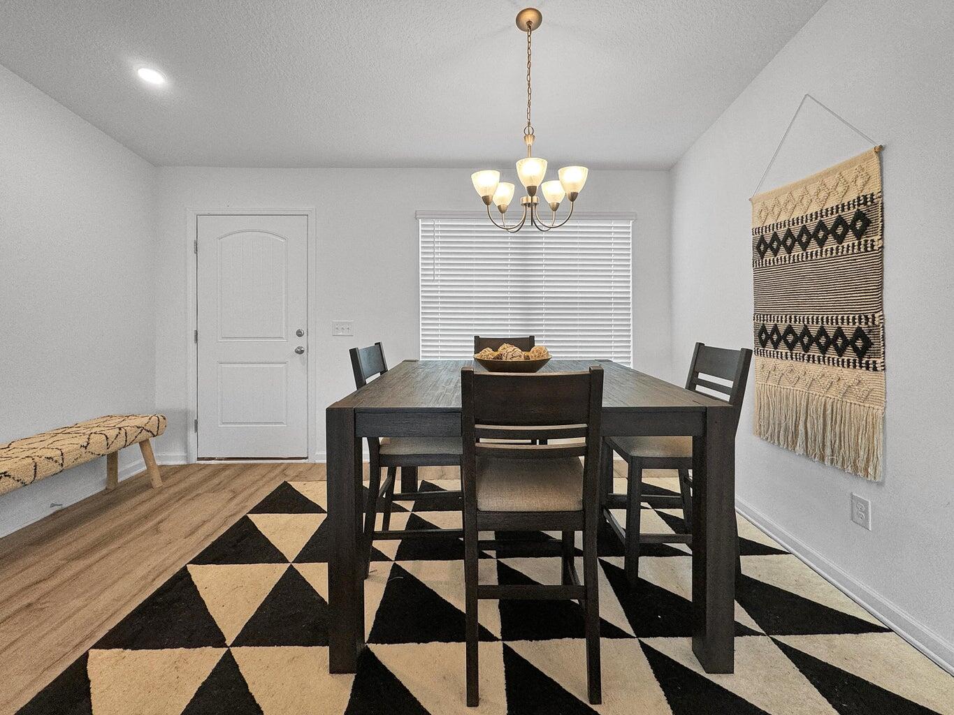 4695 Perception Circle Milton, FL 32570 - Photo 8 of 30 a view of a dining room with a table and chairs