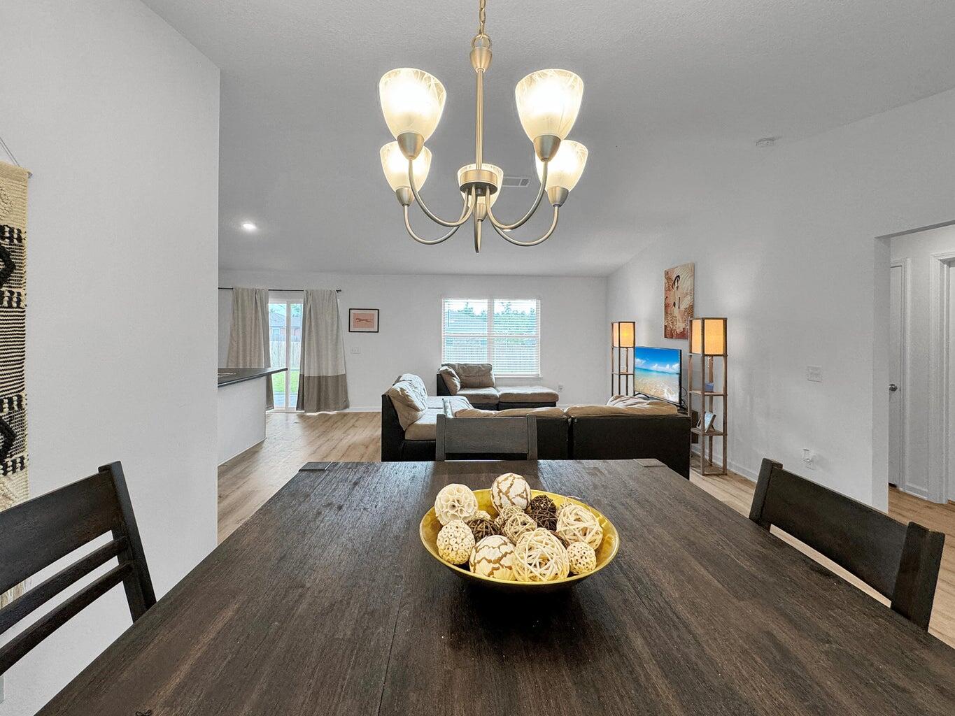 4695 Perception Circle Milton, FL 32570 - Photo 10 of 30 a view of a dining room with furniture and wooden floor