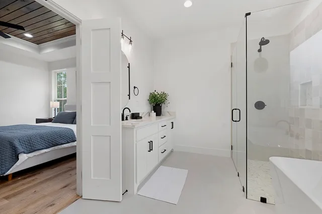 a view of a hallway with wooden floor and a floor to ceiling window