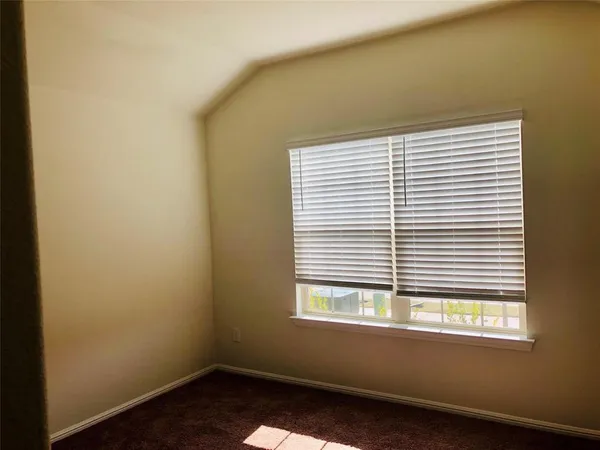 a bathroom with a granite countertop bathtub shower sink vanity and toilet