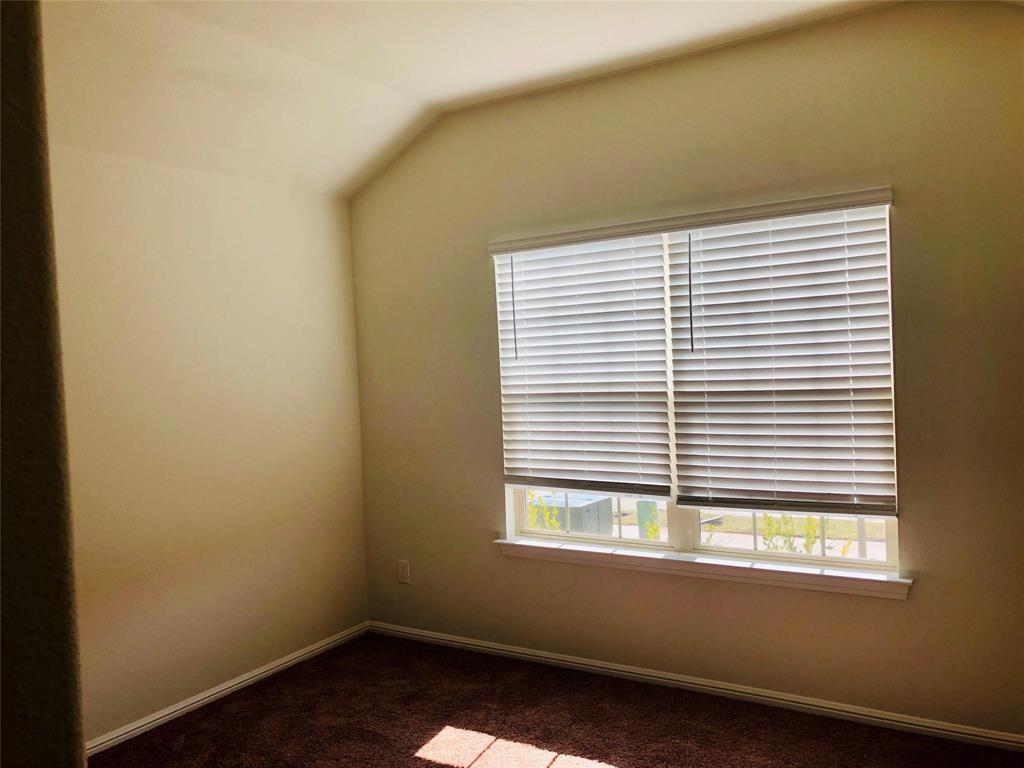 925 Rutherford Drive Crowley, TX 76036 - Photo 11 of 17 an empty room with a window