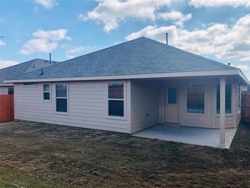 925 Rutherford Drive Crowley, TX 76036 - Photo 15 of 17 a backyard of a house with table and chairs