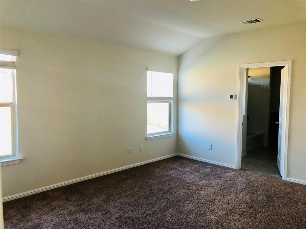 925 Rutherford Drive Crowley, TX 76036 - Photo 7 of 17 an empty room with a window