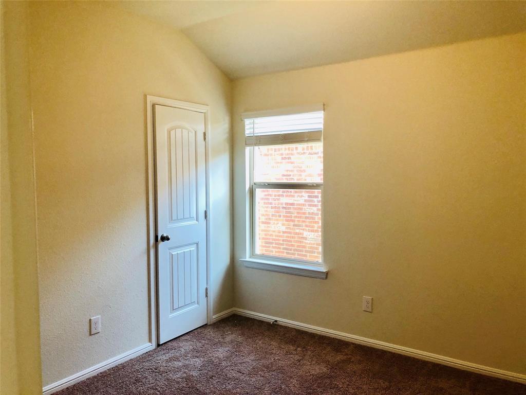 925 Rutherford Drive Crowley, TX 76036 - Photo 10 of 17 a view of an empty room with a window