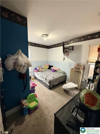 a bedroom with a bed and a table in it