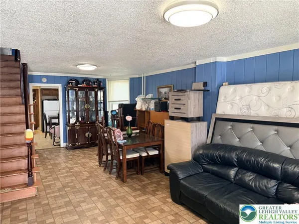a living room with furniture and a couch