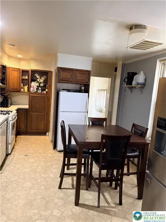 a dining room with furniture and window