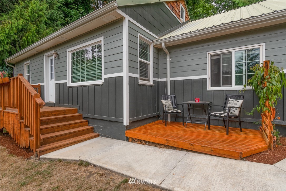 732 Coal Creek Road Longview, WA 98632 - Photo 1 of 35 a view of backyard with a patio and a garden