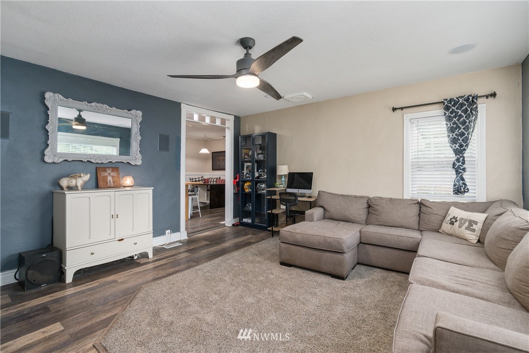 732 Coal Creek Road Longview, WA 98632 - Photo 11 of 35 a living room with furniture and a flat screen tv