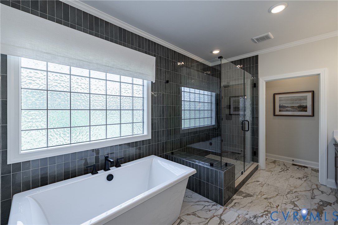 8264 Mt Eagle Road Ashland, VA 23005 - Photo 10 of 23 a bathroom with a tub a sink and a window