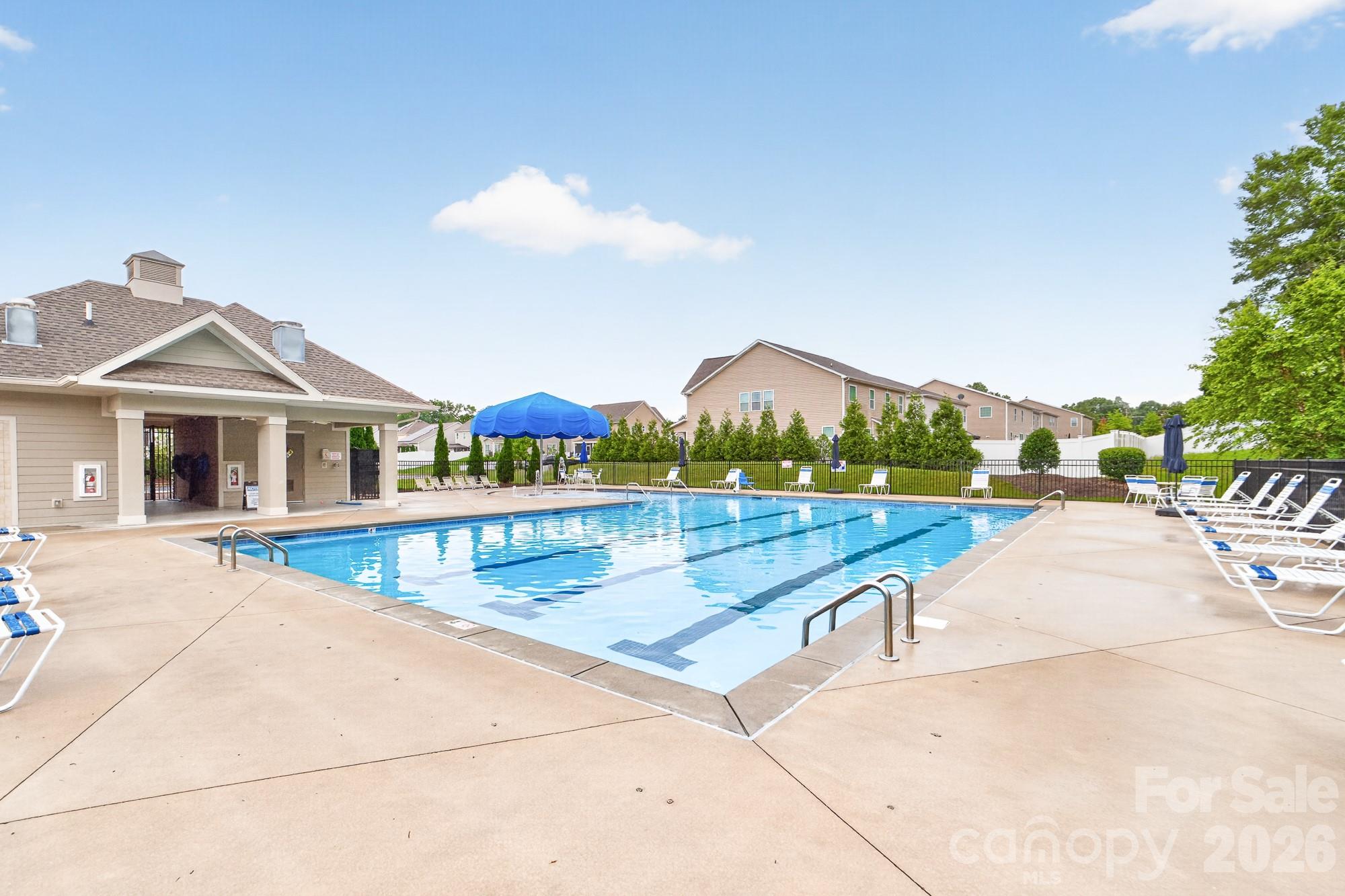 5972 Redwood Pine Road Concord, NC 28027 - Photo 35 of 37 a view of houses with outdoor space and swimming pool