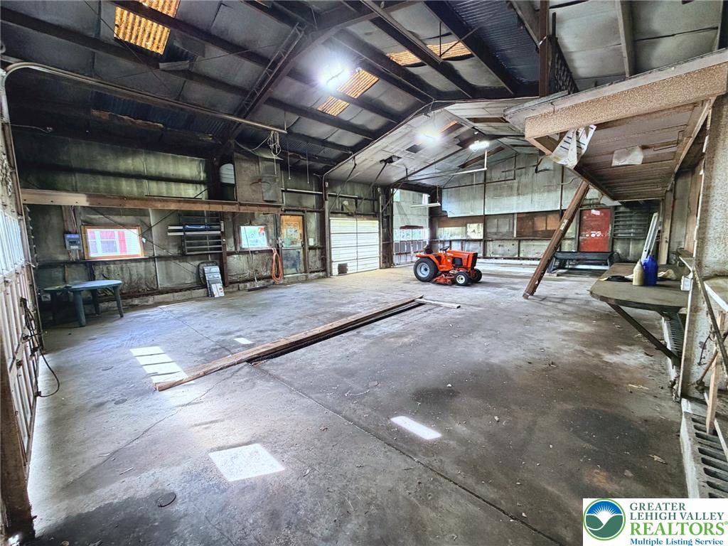 4995 Mountain Road Slatington, PA 18080 - Photo 25 of 30 A spacious barn provides ample room for equipment and storage with practical concrete flooring.