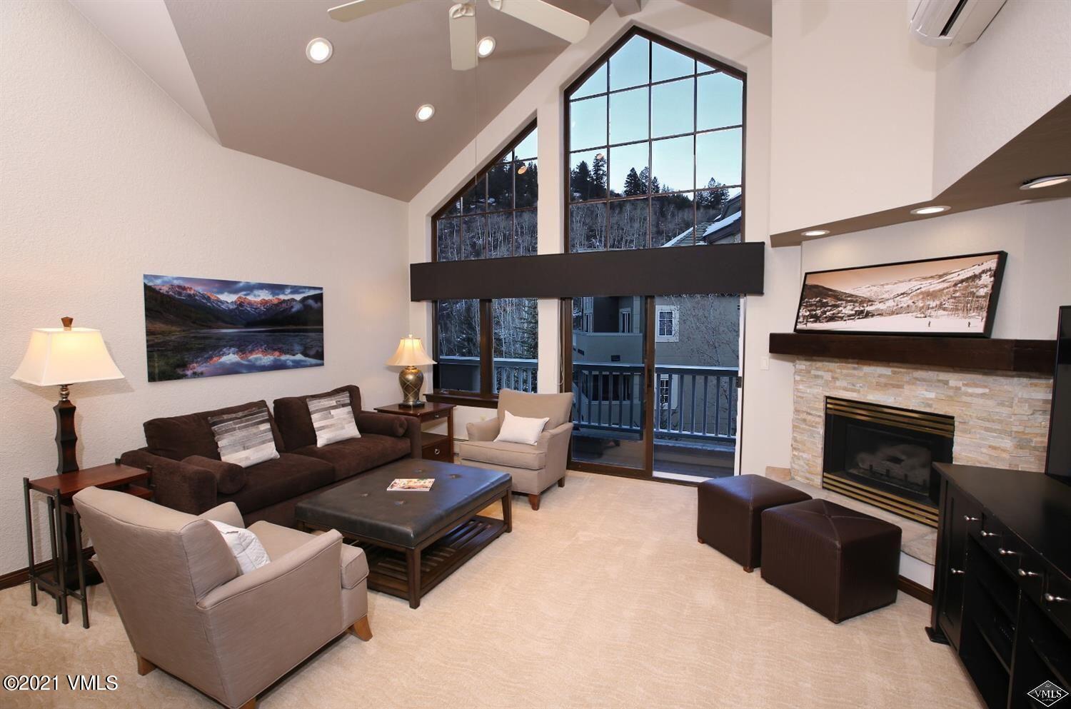 210 Offerson Road, Unit 4195 Beaver Creek, CO 81620 - Photo 1 of 16 a living room with furniture and a fireplace