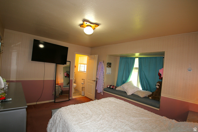 1612 East 450 South Springville, UT 84663 - Photo 28 of 48 Bedroom featuring a built-in window seat, recessed window, and wall-mounted television