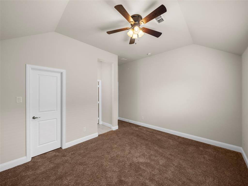 3044 Bold Ruler Road Celina, TX 75009 - Photo 15 of 36 an empty room with a fan & a ceiling fan